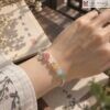 vong-tay-thach-anh-mix-charm-bac-720