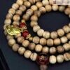 chuoi-108-hat-tram-huong-toc-kien-mix-charm-6-mm