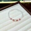 vong-tay-da-mat-trang-mix-thach-anh-dau-hat-6mm
